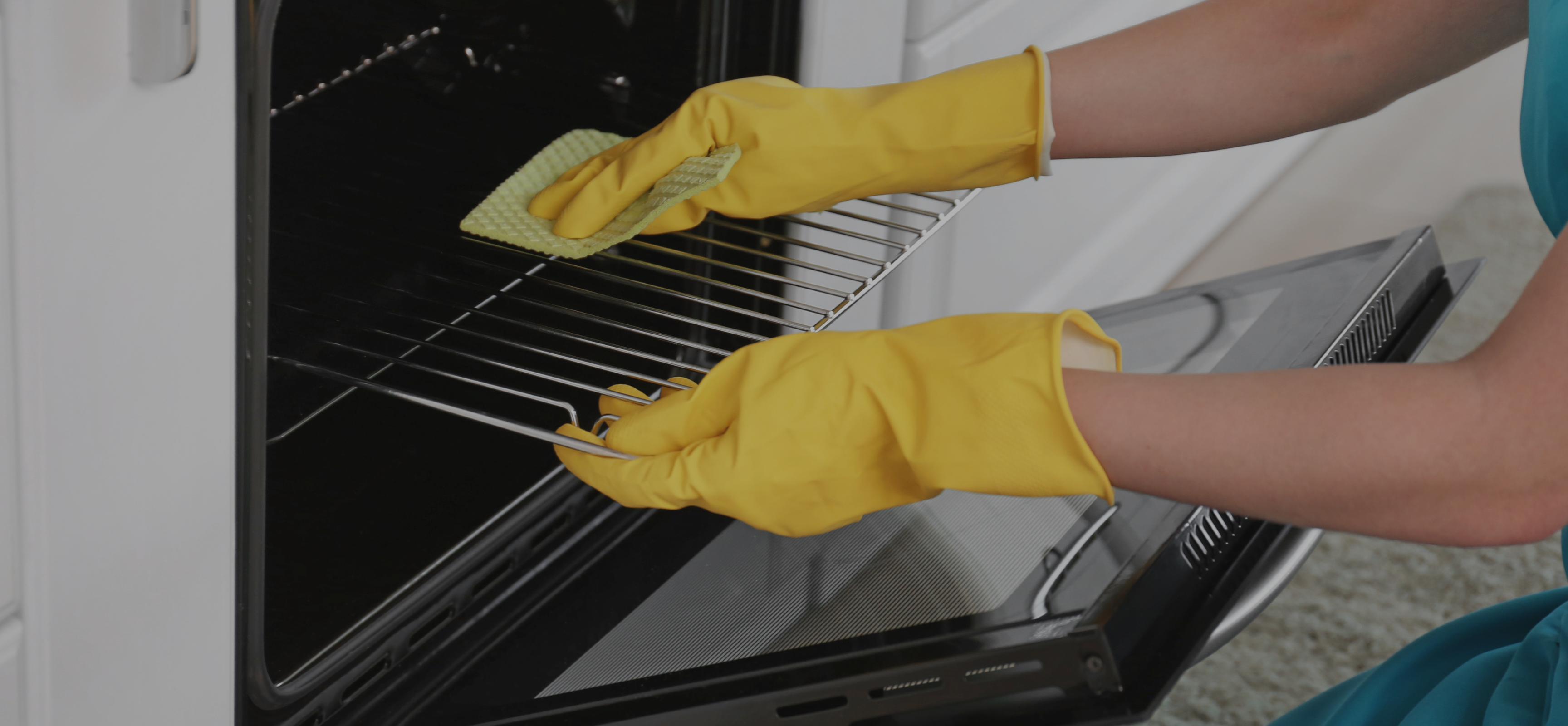 A man and woman working together to clean a living room, dusting surfaces and organizing furniture